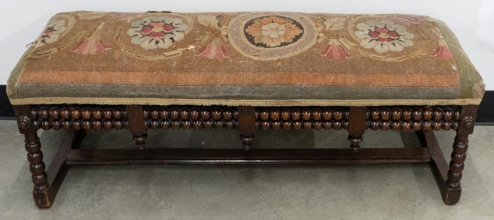 Continental Turned Mahogany and Needlepoint Upholstered Bench, 19 1/2 x 52 1/2 x 17 in. (49.5 x 133.4 x 43.2 cm.)